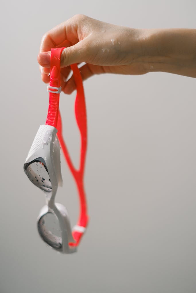 Essential swim goggle accessories and neoprene gear for open water survival