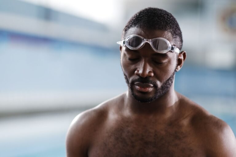 Low-light open water swimmer wearing goggles at dawn - photo by cottonbro studio