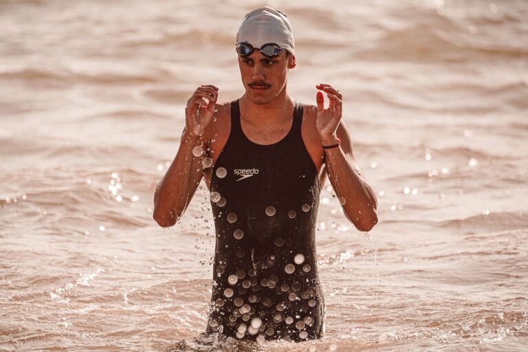 Open water swimmer wearing goggles in saltwater