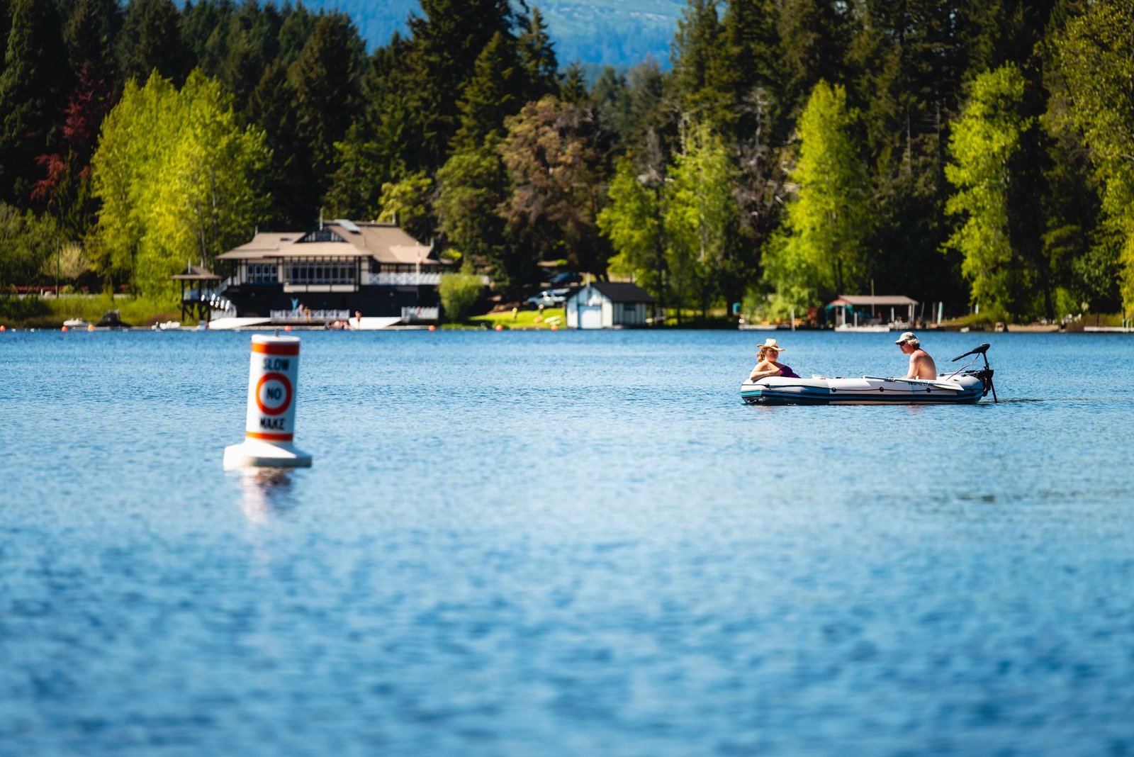Open water swimmer sighting toward a buoy while keeping rhythm