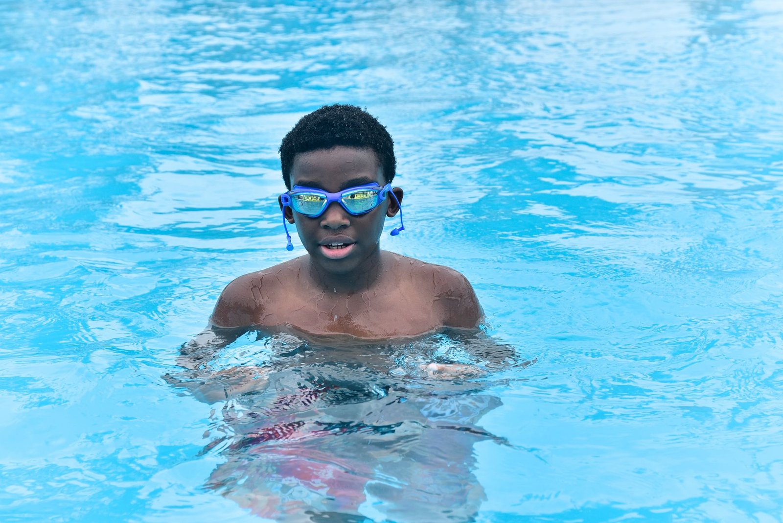 Open water swimmer checking conditions before choosing goggles